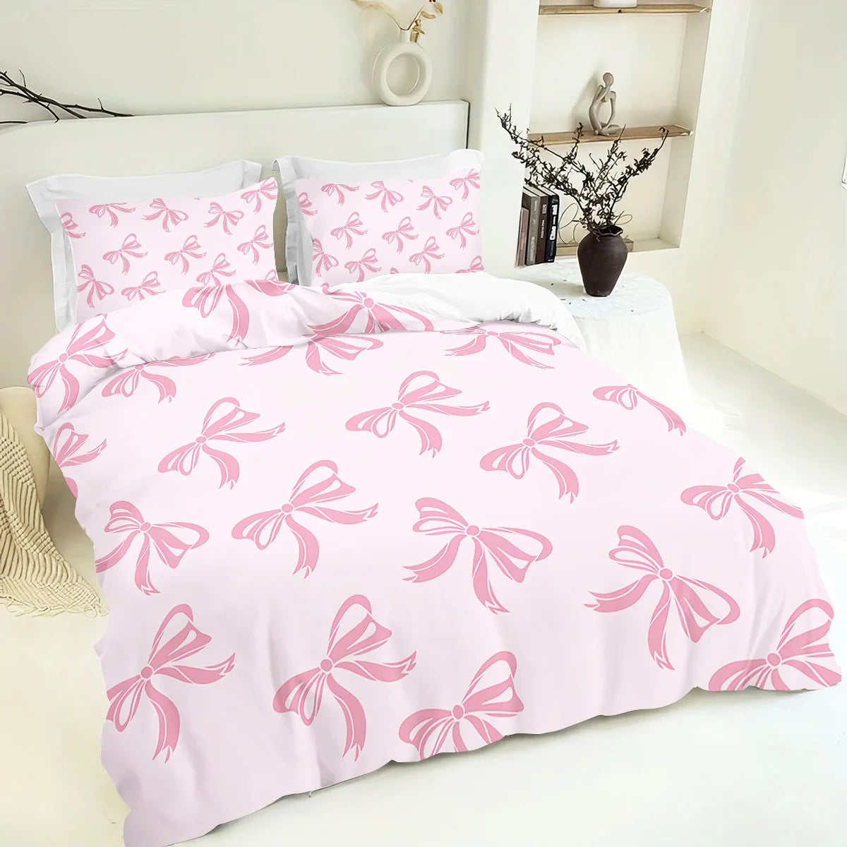 Pink bedding set featuring a butterfly pattern on a duvet cover and pillowcases.