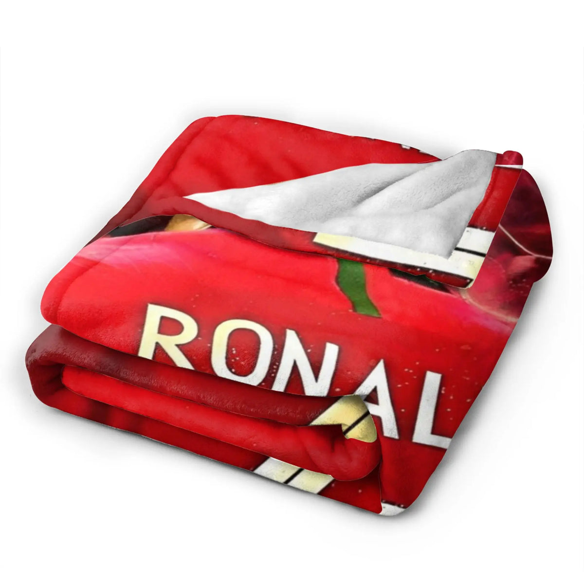 A red wool throw blanket featuring a football theme with the word RONAL visible.