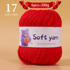 A ball of red soft yarn labeled as 6 pieces equal to 300 grams for handmade knitting thread.