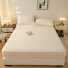 A plush rabbit winter fitted bed sheet set displayed on a modern bed with white linens and pillows.