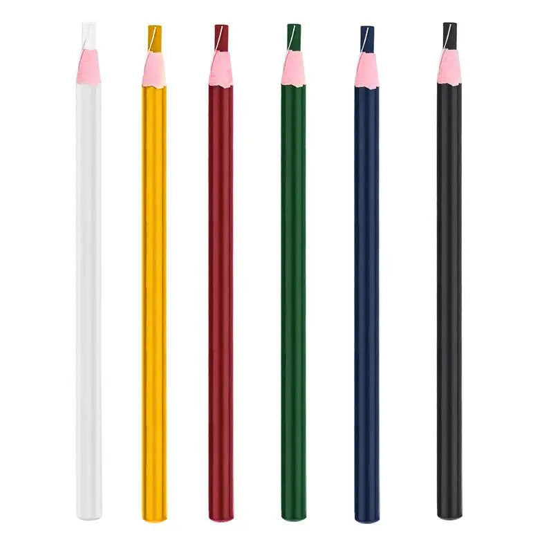 A set of five fabric chalk markers in various colors including pink, yellow, and dark green.