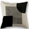 Abstract geometric pillow cover featuring a patchwork of black, gray, and beige squares.