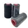 Spool of black cotton hair weave thread with a red cap for crafting
