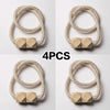 Four beige braided magnetic curtain tiebacks with square accents