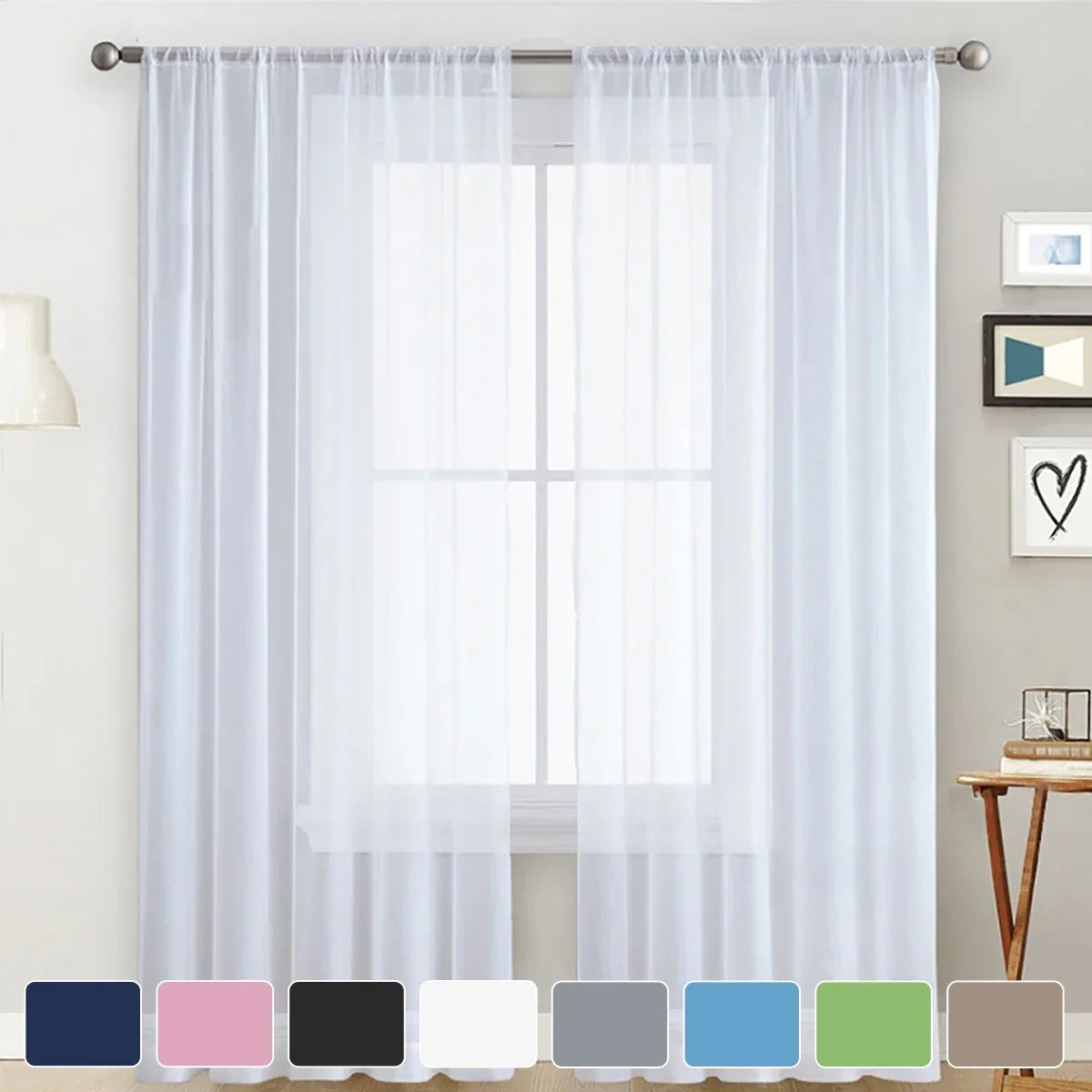 Modern sheer white curtain with rod pocket covering a window in a living room or bedroom.