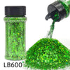A glass bottle of green holographic glitter and a pile of loose green glitter.