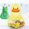 A yellow cartoon duck mesh bath toy organizer with adhesive hooks sits on a white sink surface.