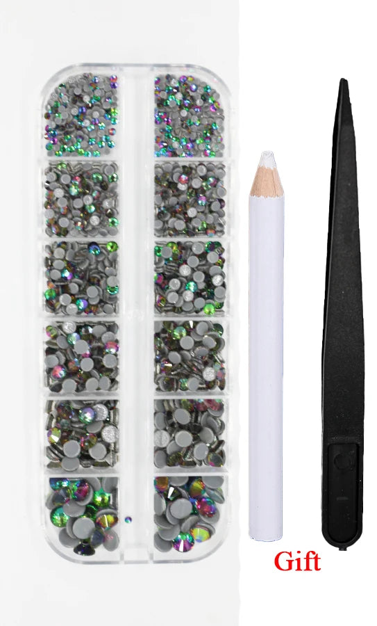 A clear plastic case containing a set of crystal hot fix rhinestones and an applicator tool.