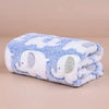 A soft blue and white flannel blanket featuring a pattern of elephants for pets.