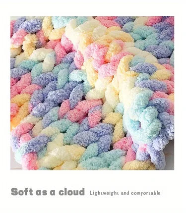 A close-up of fluffy, multi-colored hand-knitted yarn in pastel shades like pink, yellow, blue, and purple.