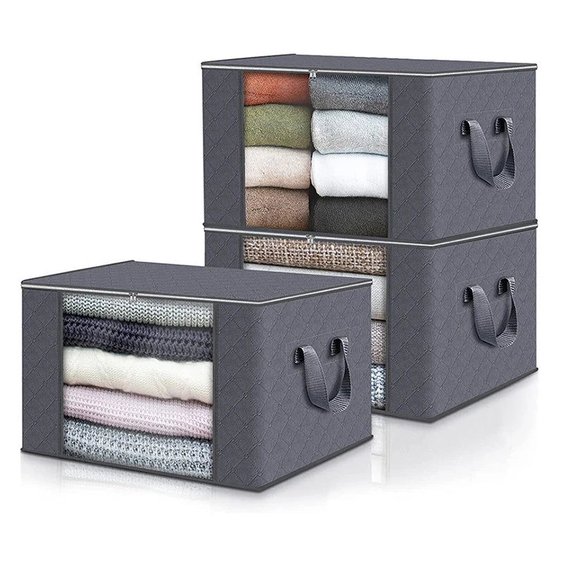 A gray foldable clothes organizer box with a clear window showing various folded fabric items.