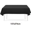 A black rectangular tablecloth displayed on a white table.