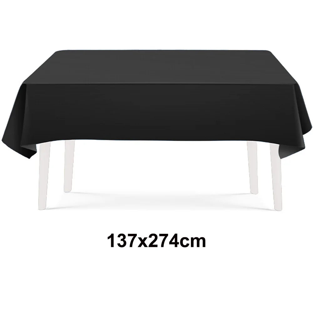 A black rectangular tablecloth displayed on a white table.