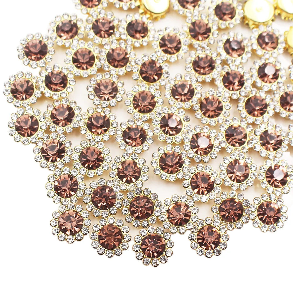 Close-up of sunflower crystal rhinestone sew-on buttons in shades of rose gold and clear stones.