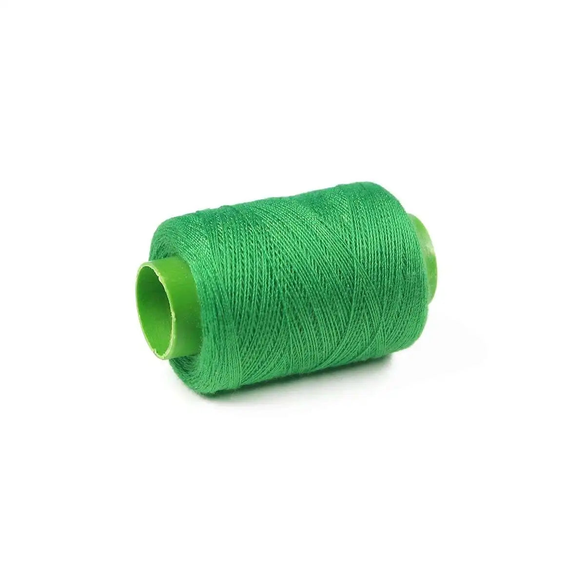 A spool of bright green handmade sewing thread.