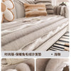 A close-up of a plush sofa cover in gray stripes, showing features like anti-slip lining and durable stitching.
