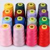 A collection of colorful sewing thread spools in various shades including yellow, green, purple, and pink.
