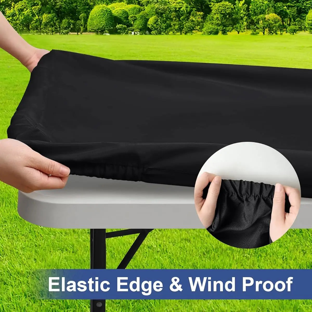 A hand is holding a black elastic edge and wind proof tablecloth over a white table.