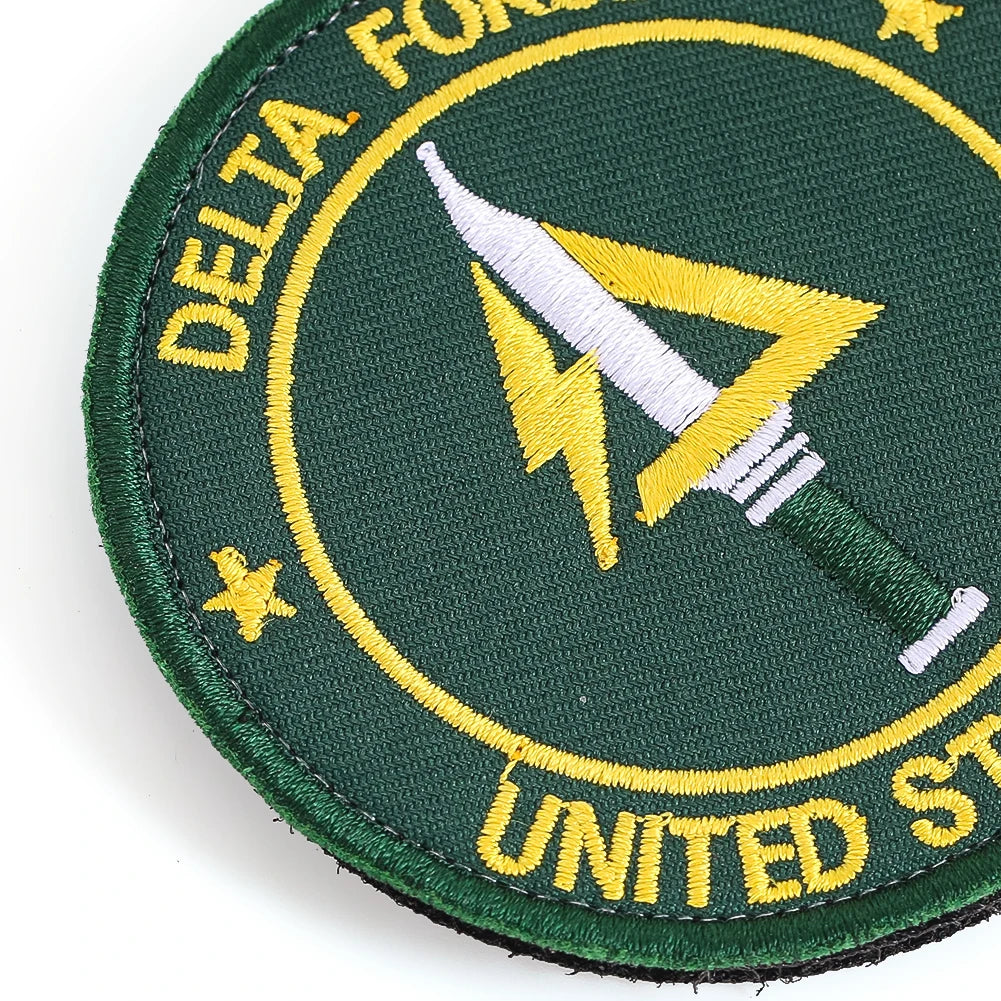 Dark green embroidery patch featuring a yellow lightning bolt design and text on the edge.