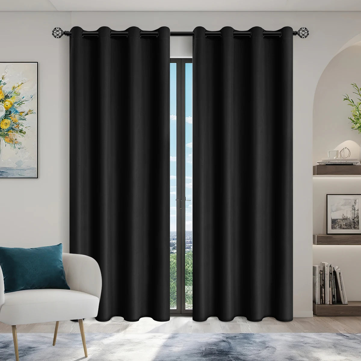 Solid black blackout curtains hanging in a doorway, used for bedroom or living room window treatment.