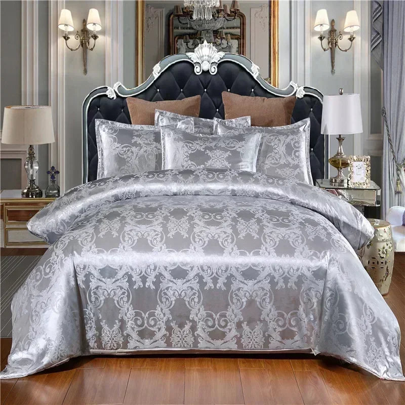 A luxury royal style duvet cover set featuring silver gray fabric with intricate damask patterns on a bed.