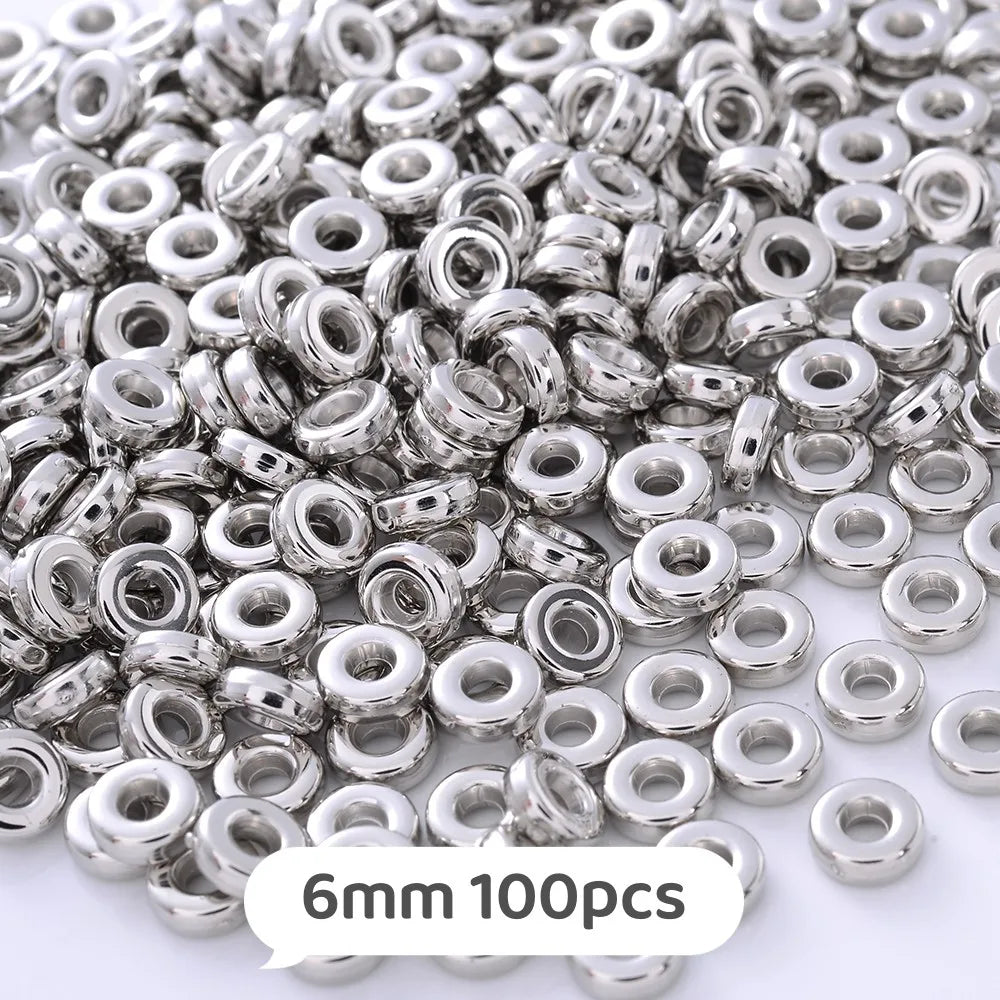 A pile of silver metallic geometric beads for jewelry making