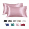 A set of satin silk pillowcases in various shades including pink, gray, white, blue, green, and red.