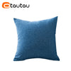 A solid blue linen cushion cover with a textured weave.