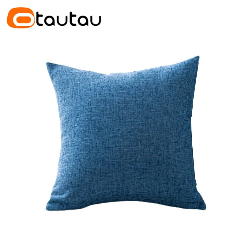 A solid blue linen cushion cover with a textured weave.