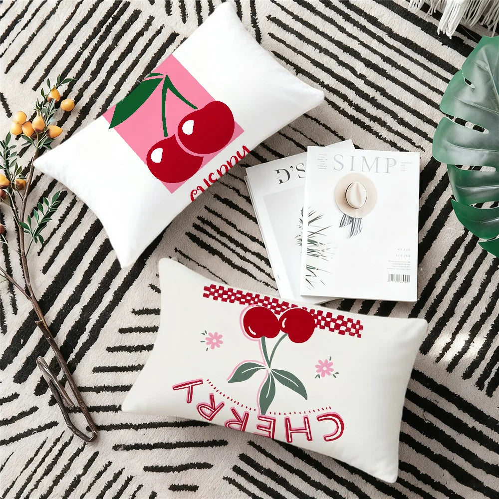 A set of chibi anime cartoon cushion covers featuring cherry designs on a black and white striped background.