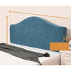 A teal soft elastic headboard cover is displayed on a bed, showing its texture and fit.