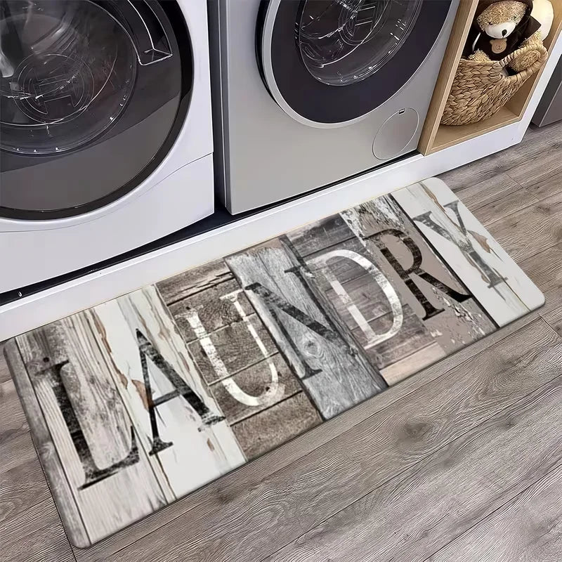 A rectangular indoor rug featuring the word LAUNDRY printed in distressed wood grain style.
