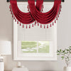 A deep red European style window curtain valance with tassels is displayed over a white plantation shutter window.