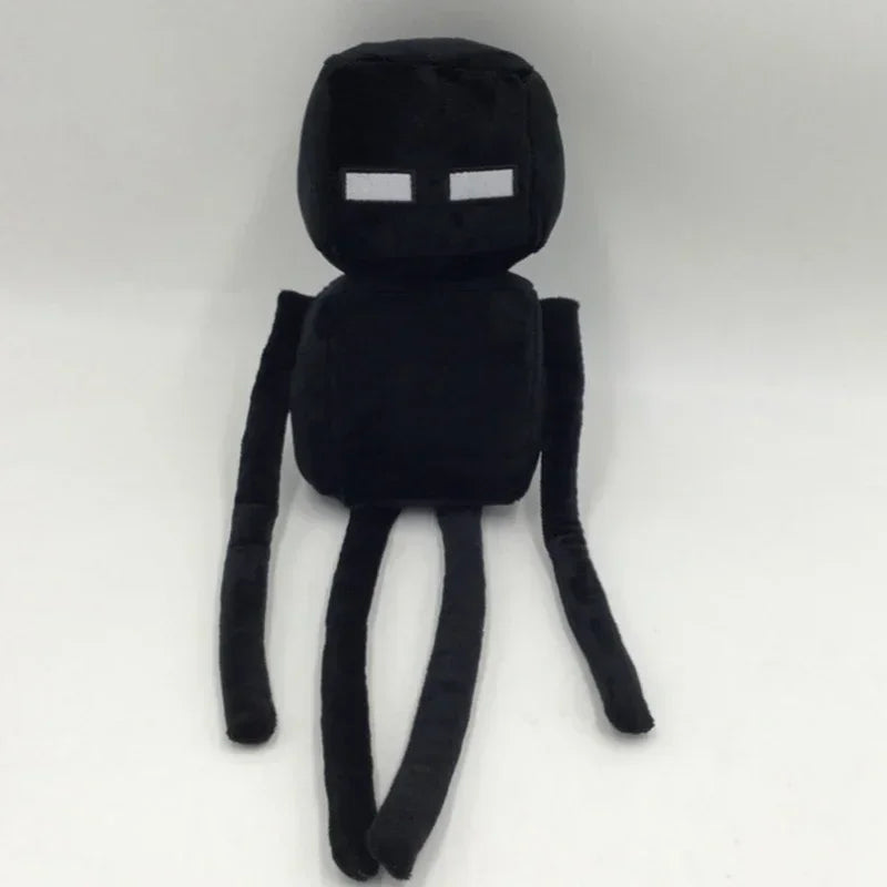 A black stuffed dragon plush toy with white eyes and long limbs.