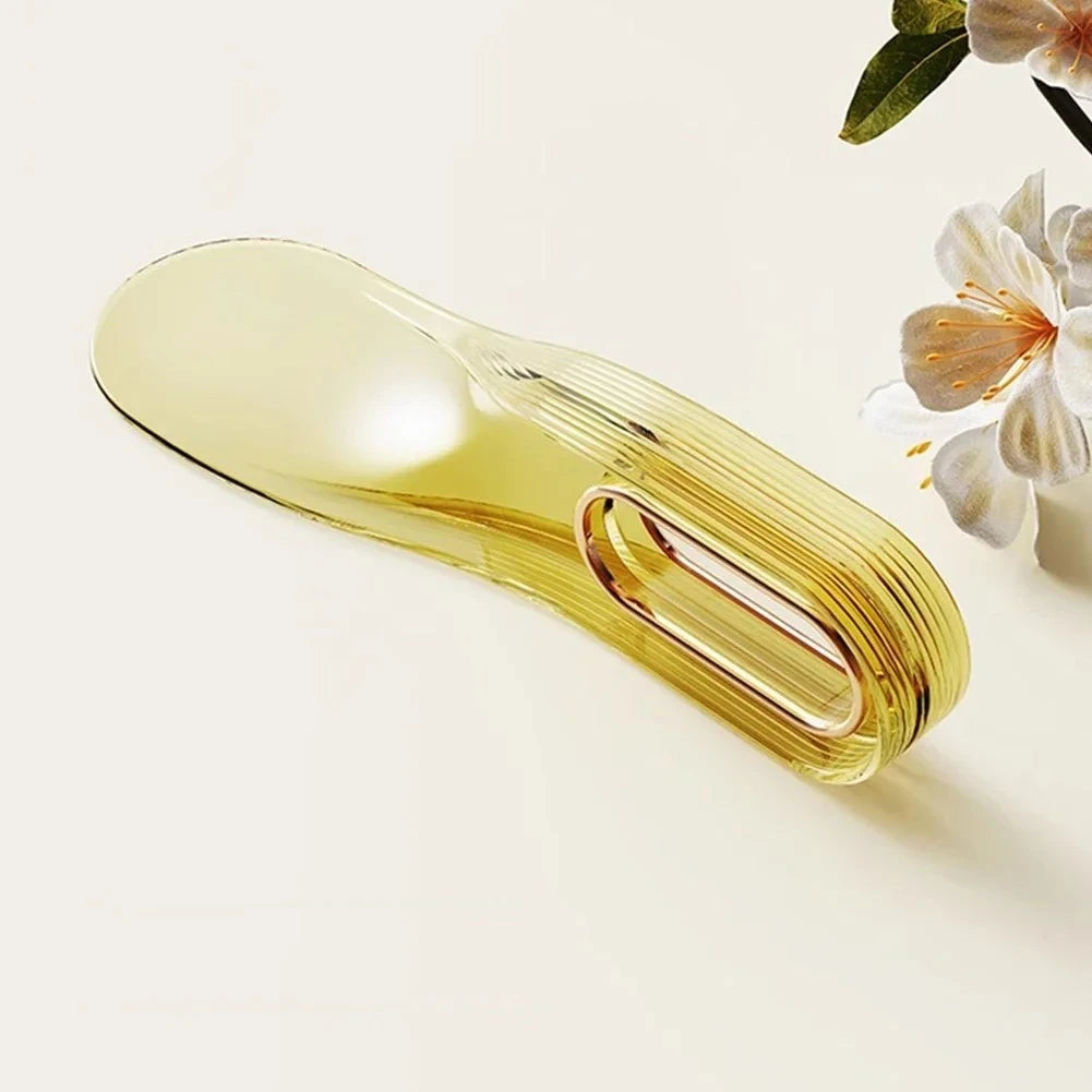 A translucent yellow mattress lifter wedge is shown against a light background with a flower in the upper right corner.