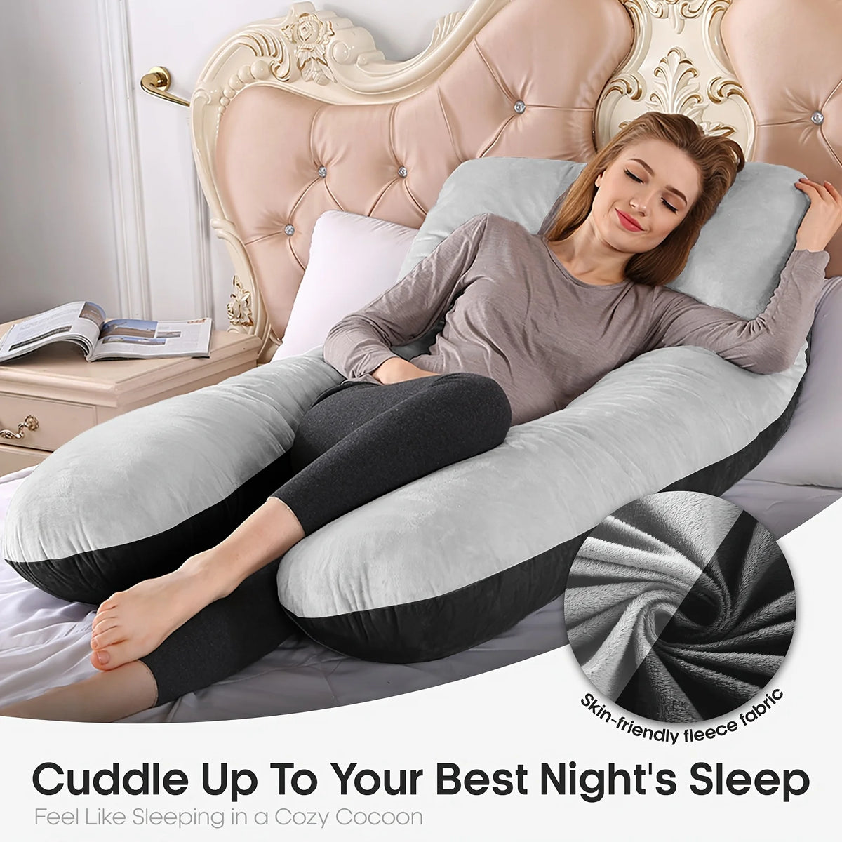 A woman relaxing on a beige U-shaped memory foam pillow with gray and black accents for a cozy night's sleep.