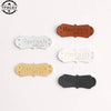 A collection of five PU leather embossed tags in various shades of brown and gray for handmade crafting.