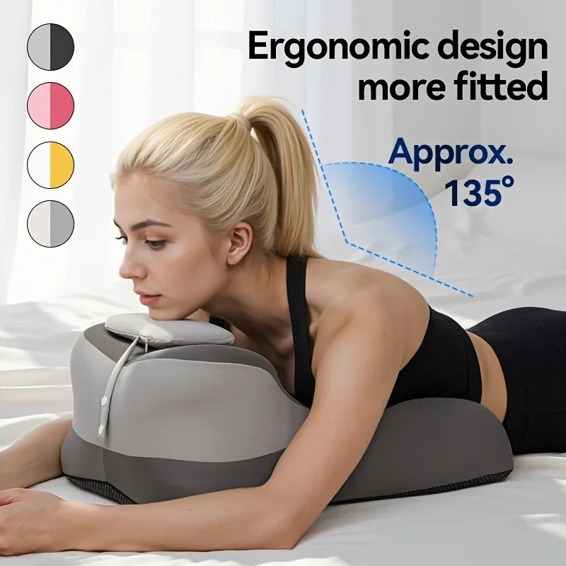 A woman is using a gray ergonomic pillow for neck and back support while lying down.