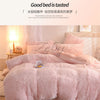A pink plush mink velvet duvet set is displayed on a bed with white curtains and wooden furniture.