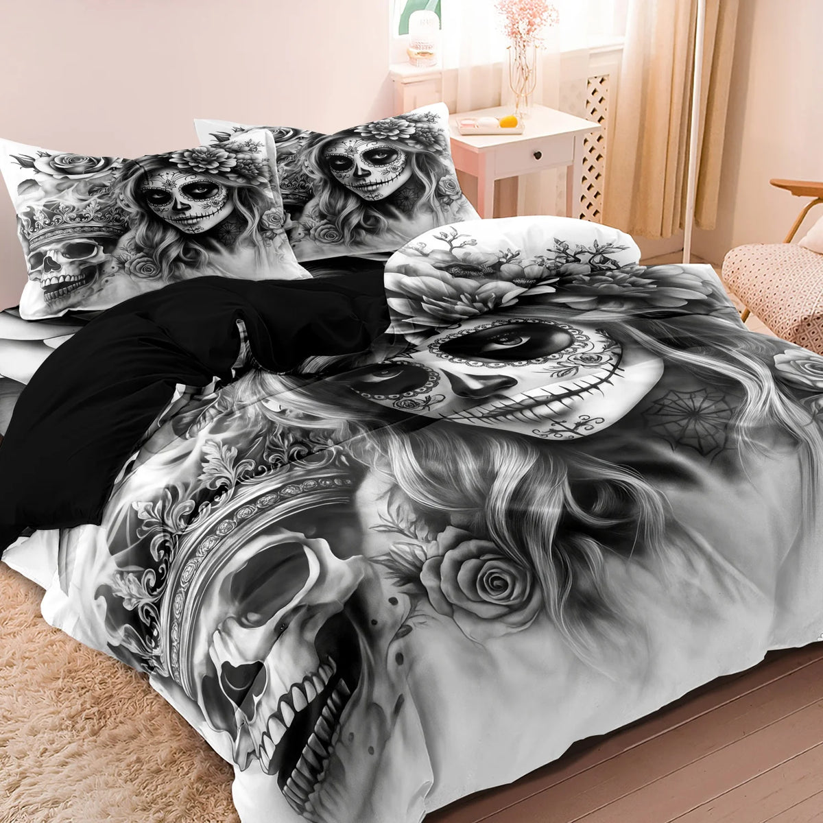 A black and white print of a skull and roses on a duvet cover set.