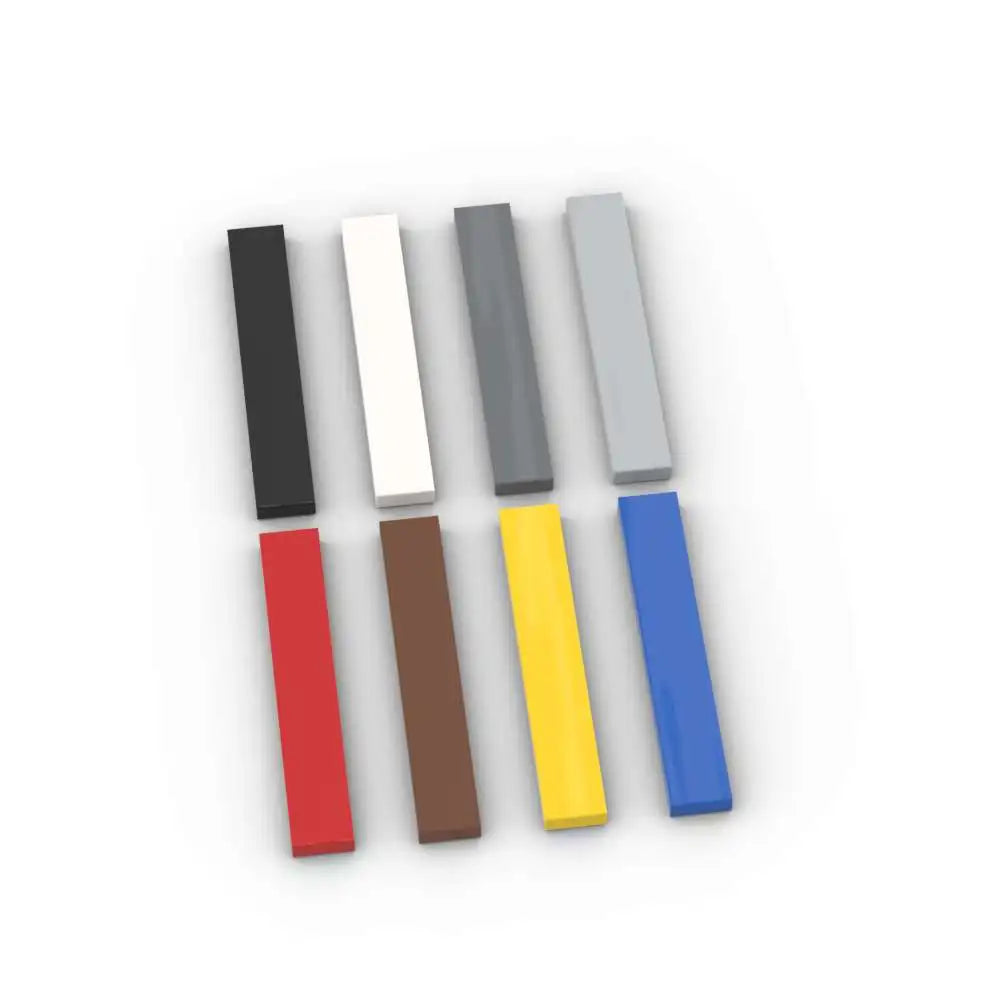 A set of six colored puzzle building blocks arranged in a row: black, white, gray, and three shades of blue/yellow.