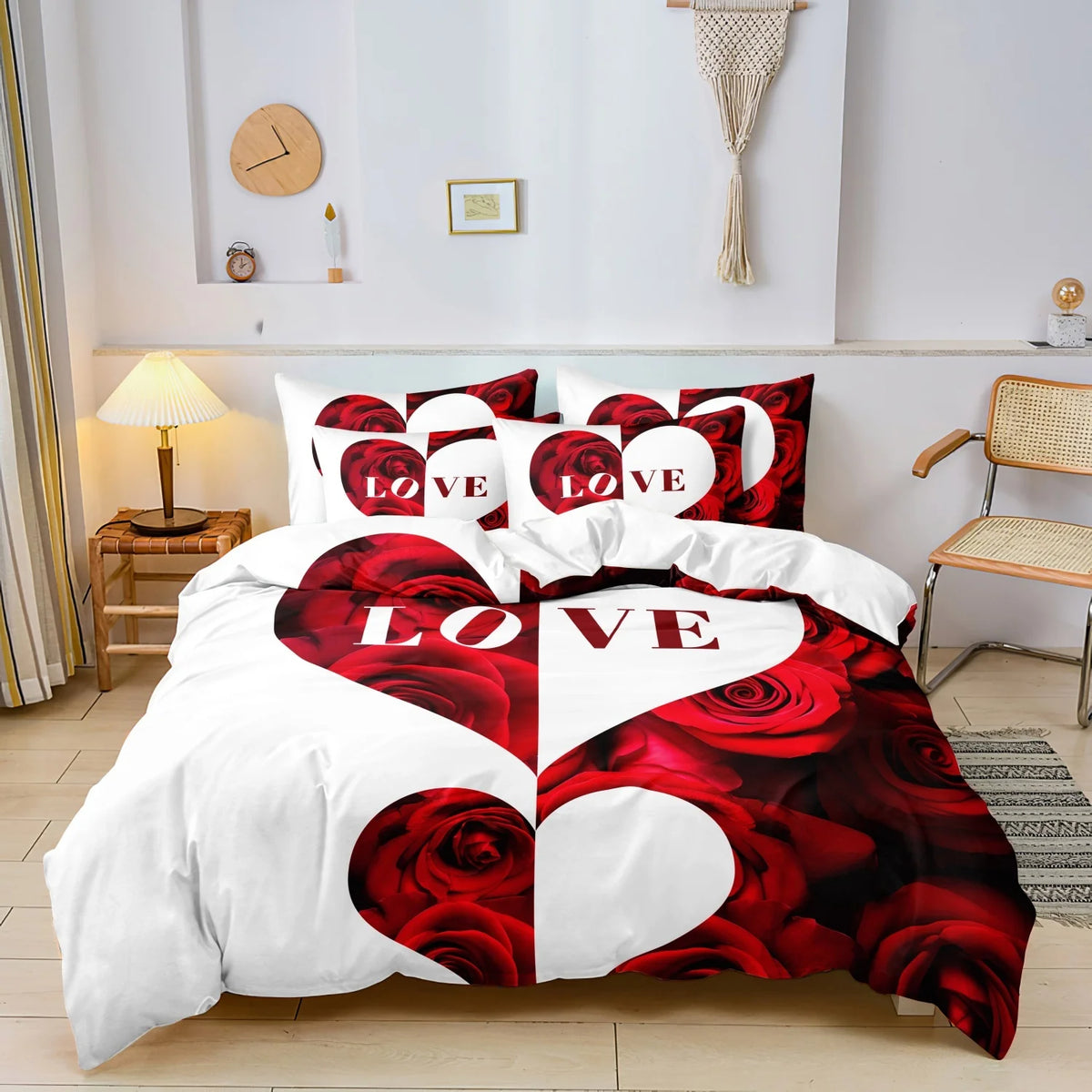 A bedding set featuring a large red rose heart design on white fabric with smaller hearts and text.