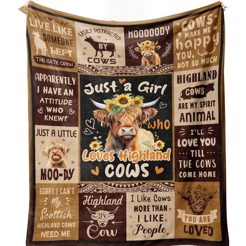 A patterned flannel blanket featuring text and illustrations about Highland cows and Scottish themes.