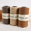 Three spools of brown hollow yarn for knitting and crochet