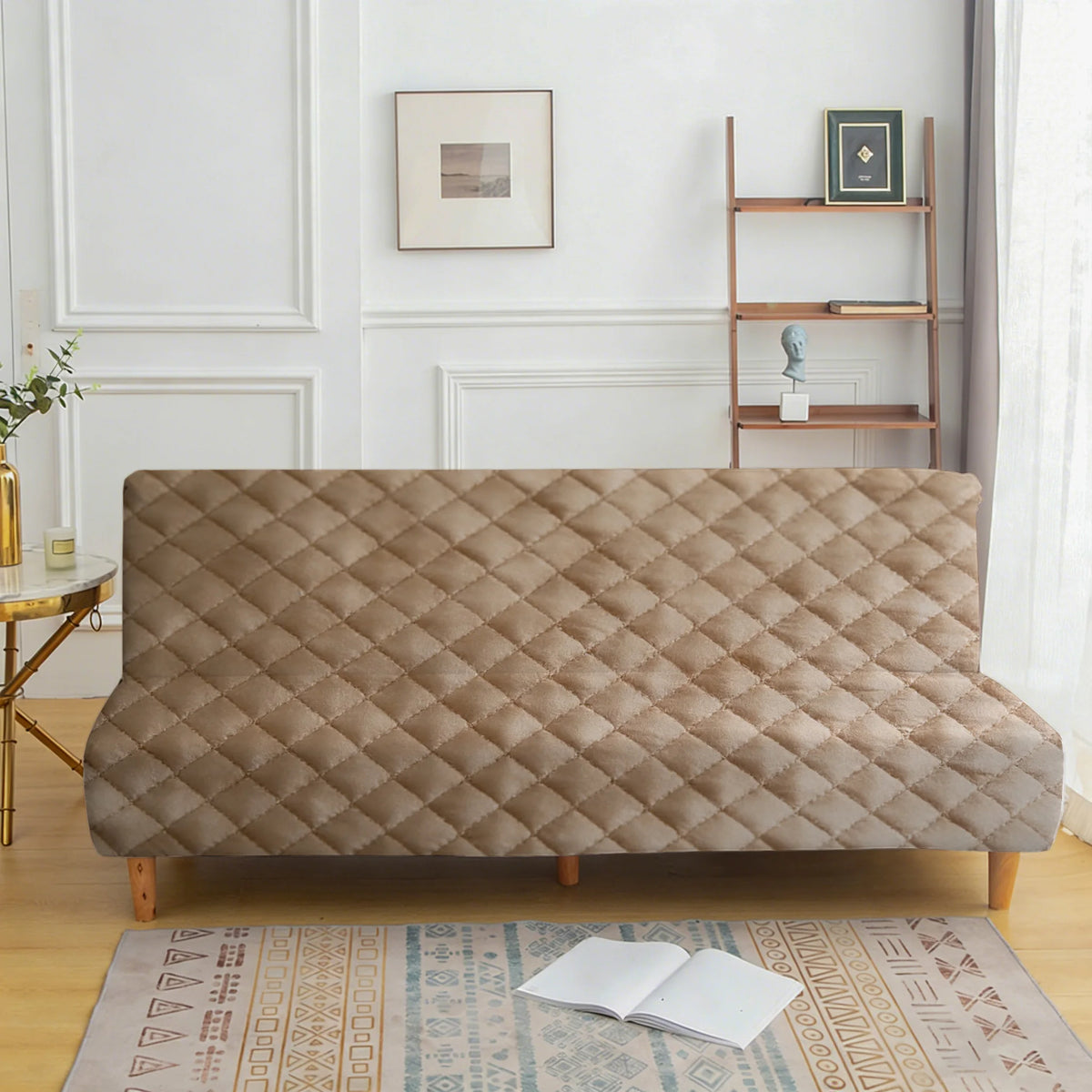 A beige velvet non-slip armless sofa cover displayed on a wooden frame with a patterned rug.