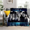 A dark blue fleece throw blanket featuring a collage of Stray Kids Kpop members' faces.