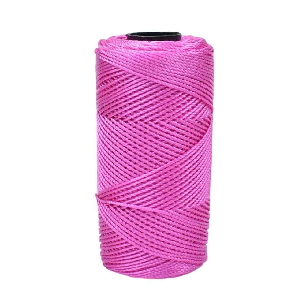 A spool of bright pink 1.5mm cotton silk thread for knitting and crafting.