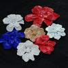 A collection of five red, blue, and white rhinestone flower applique patches for clothing.