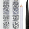 A clear plastic container holds various sizes and colors of crystal hot fix rhinestones and an applicator tool.