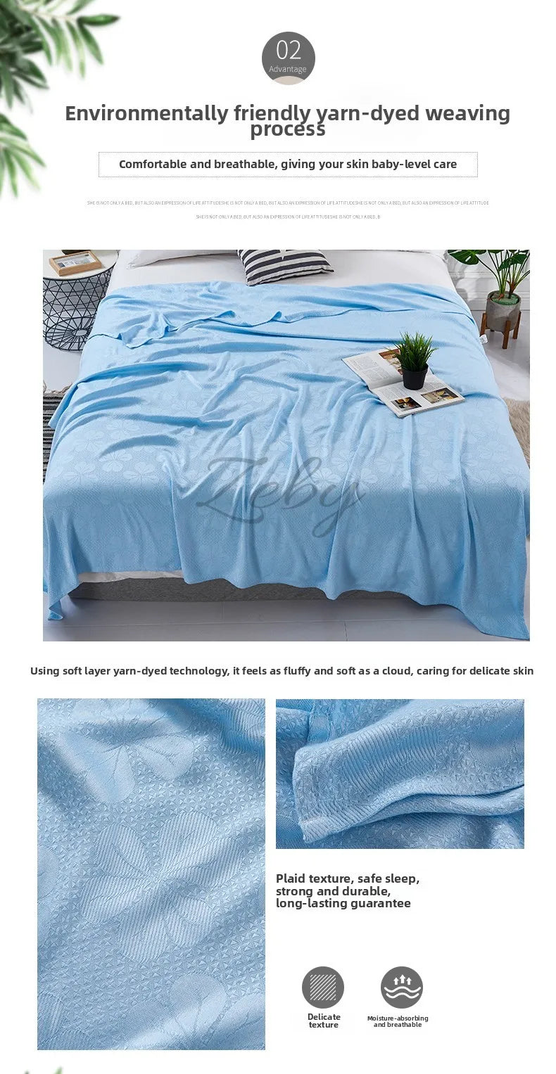 A light blue bamboo fiber blanket draped over a bed, highlighting its soft texture and breathable qualities.
